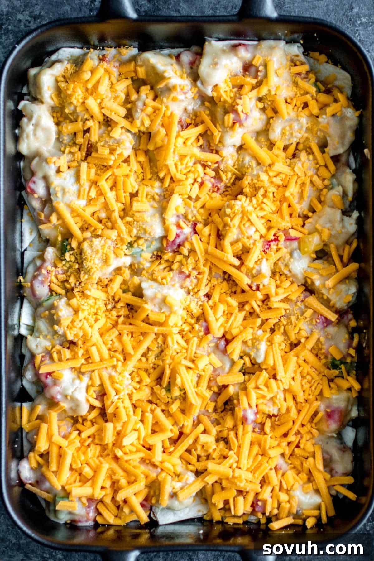 A layer of melted cheese in the King Ranch Chicken Casserole