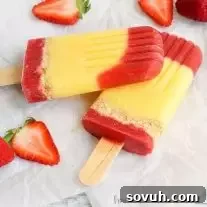 A refreshing Strawberry Shortcake Popsicle with layers of strawberry puree, vanilla pudding, and Nilla Wafer crumbles.