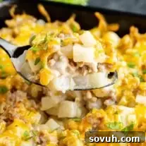 A spoonful of cheesy Sausage potato casserole