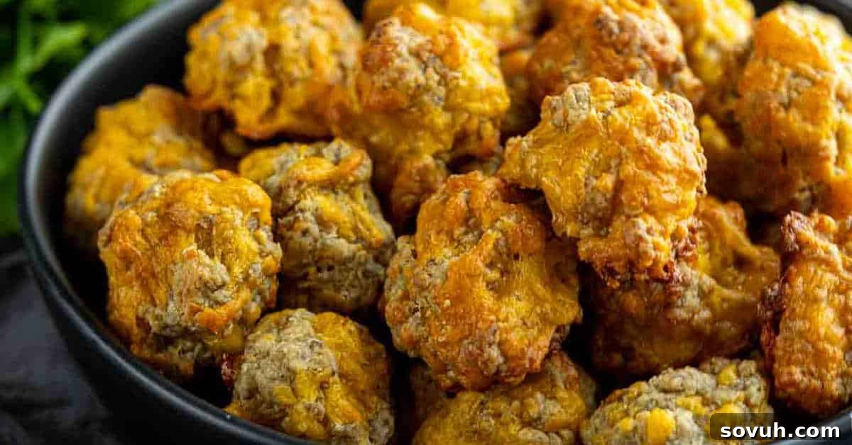 A bowl filled with baked sausage balls, featuring a crispy golden-brown exterior.