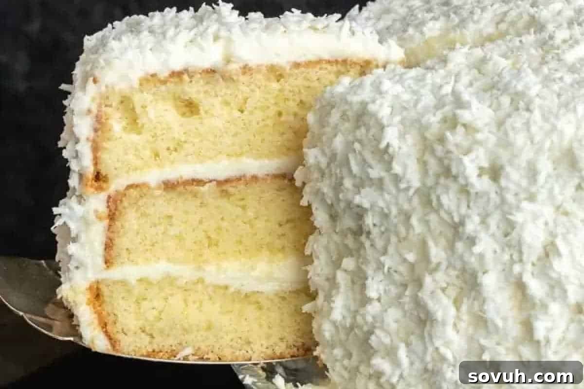 Whimsical Easter Treats Made Simple 10 Three-layer coconut cake with white frosting and shredded coconut topping, a slice being served.