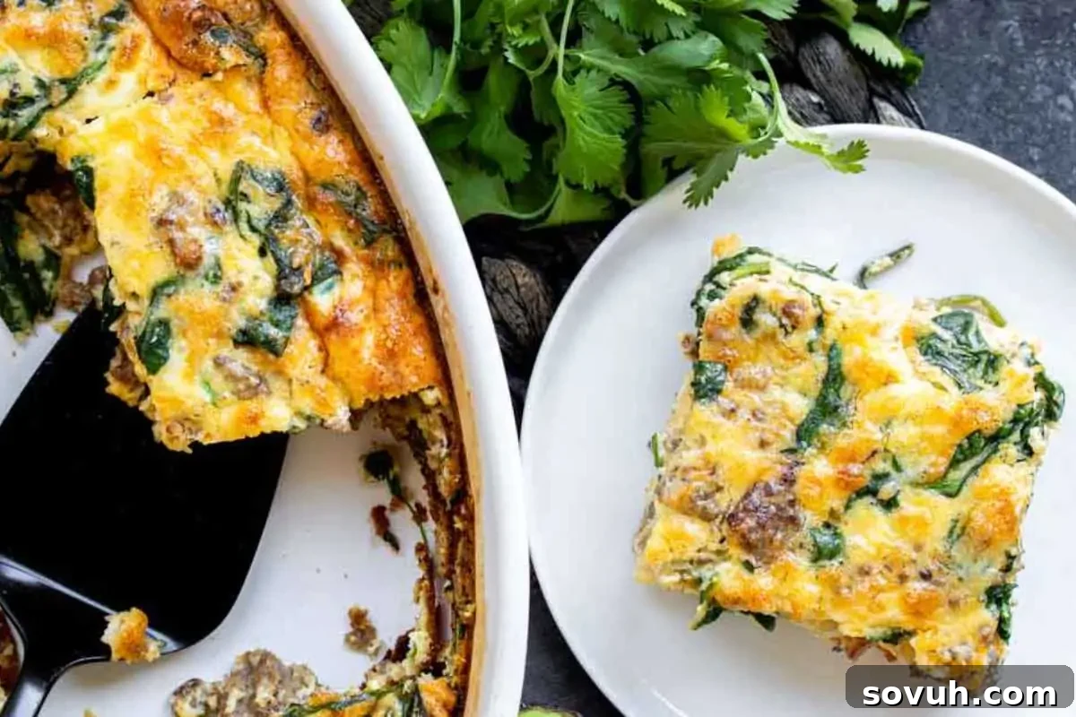 A slice of spinach and cheese frittata on a white plate with a full frittata in a ceramic dish beside it, garnished with fresh parsley.