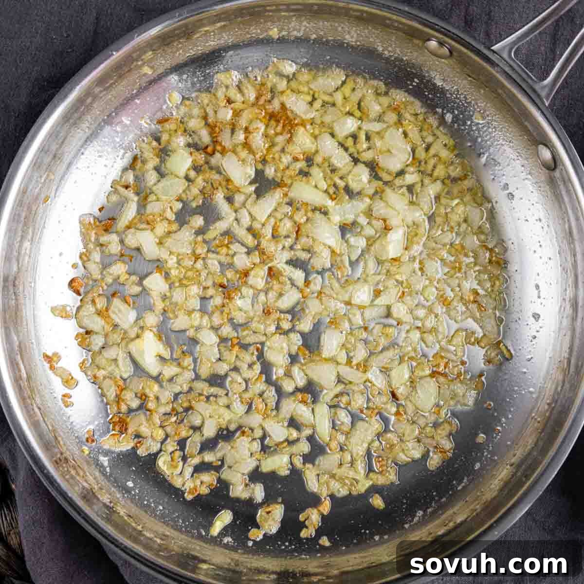A pan with onions for Ham and Cheese Strata