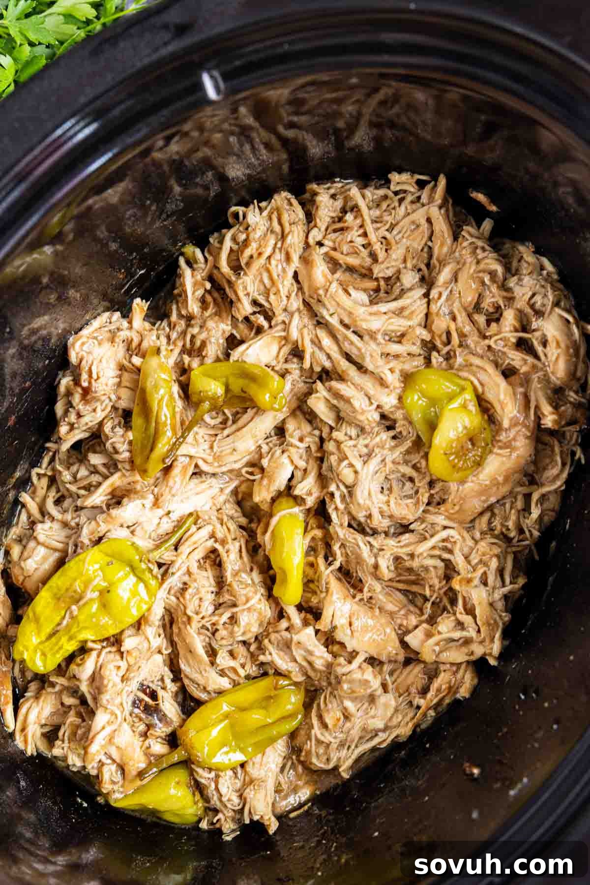 Shredded chicken with pepperoncini peppers, this Crockpot Mississippi Chicken is the ultimate dump and go crockpot meal.