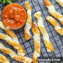 Cheese Twists on cooling rack with dipping sauce