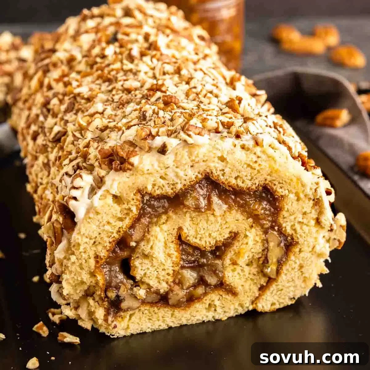 Pecan Pie Cake Roll on a black platter