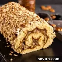 Pecan Pie Cake Roll on a black platter