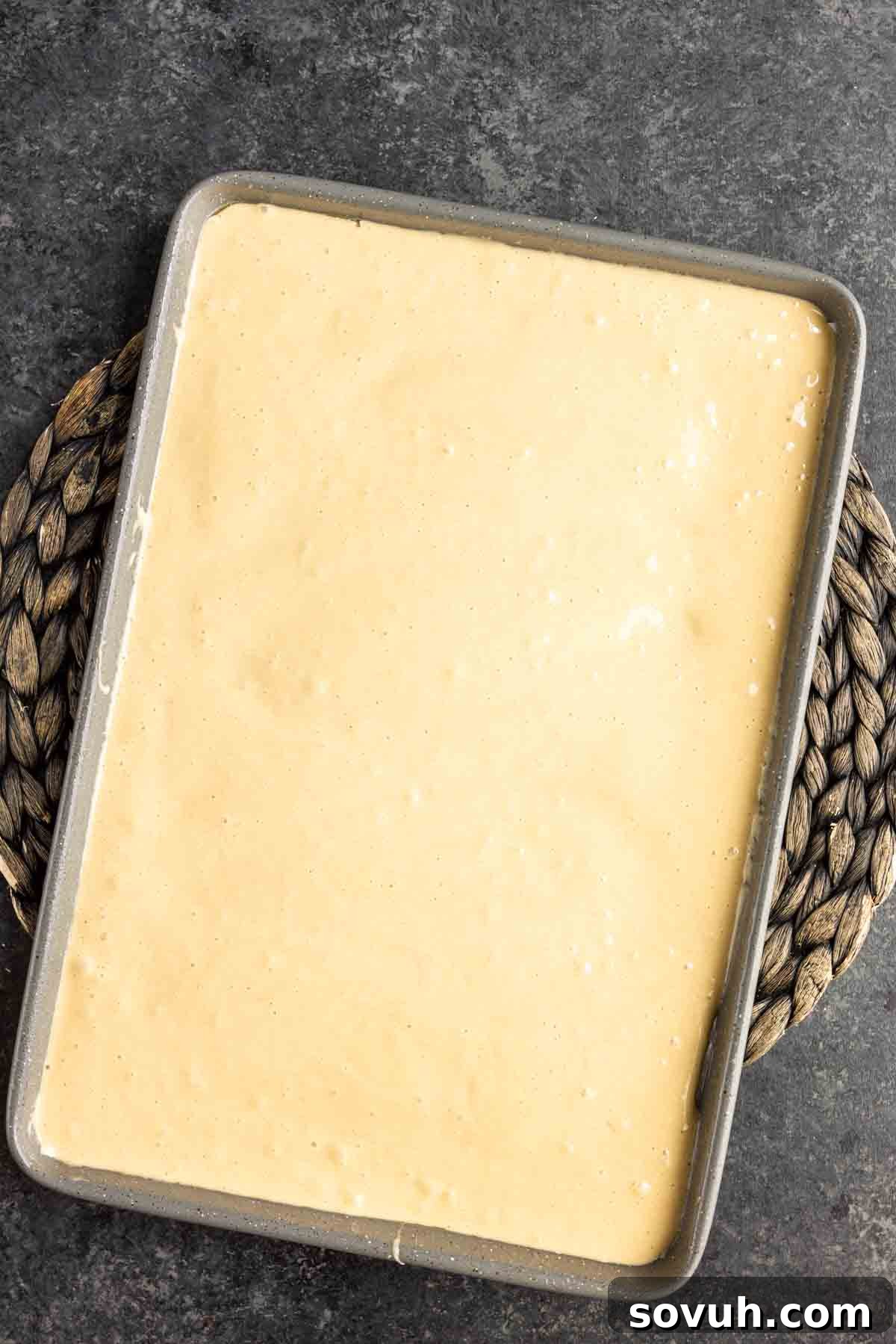 Pecan Pie Cake Roll cake batter in a jelly roll pan