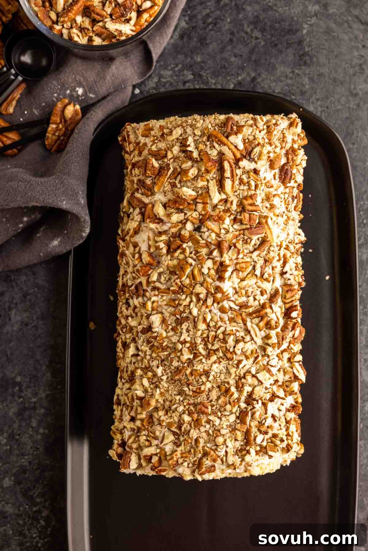 Pecan Pie Cake Roll on a black platter