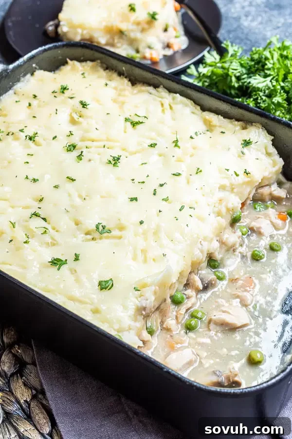 Close-up of baked Turkey Shepherd’s Pie in a casserole dish, ready to be served