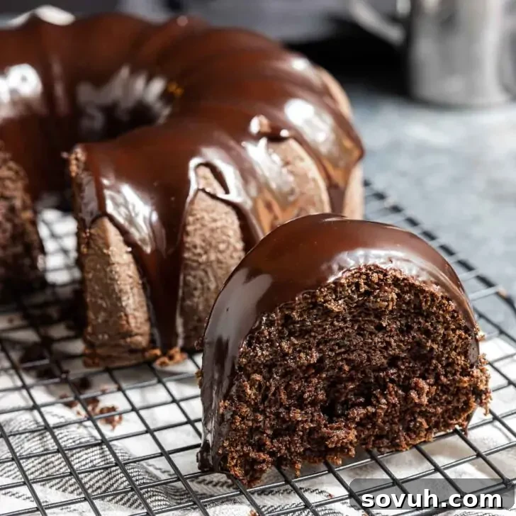 slice of Chocolate Fudge Cake on cooling rack
