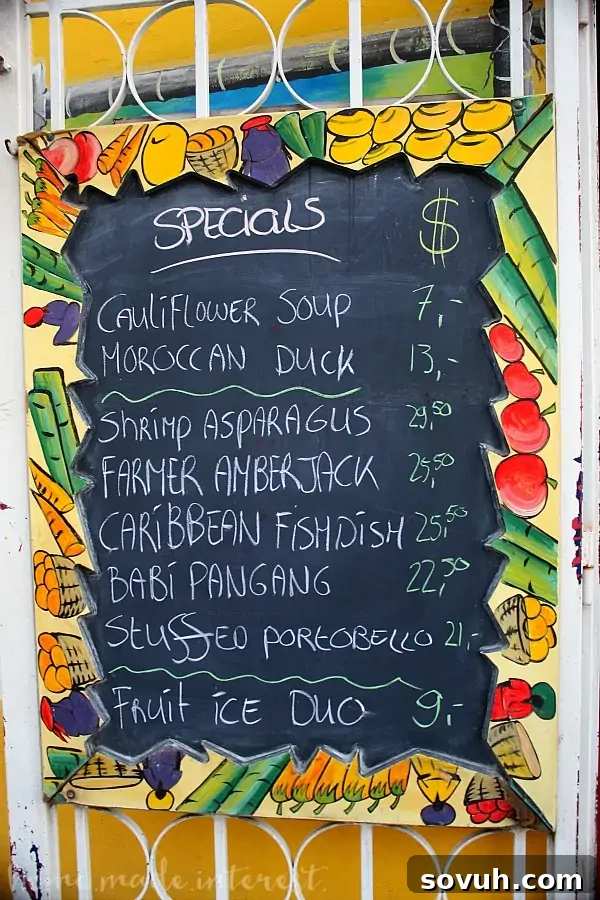 Outside menu showcasing the diverse specials at Que Pasa Restaurant in Aruba.