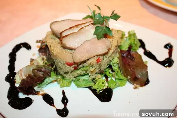 Moroccan duck served with couscous, a favorite dish from Que Pasa Restaurant in Aruba.