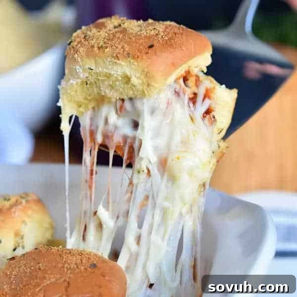 Easy Meatball Sliders with melted mozzarella cheese on soft slider buns, perfect for game day or a fun dinner.