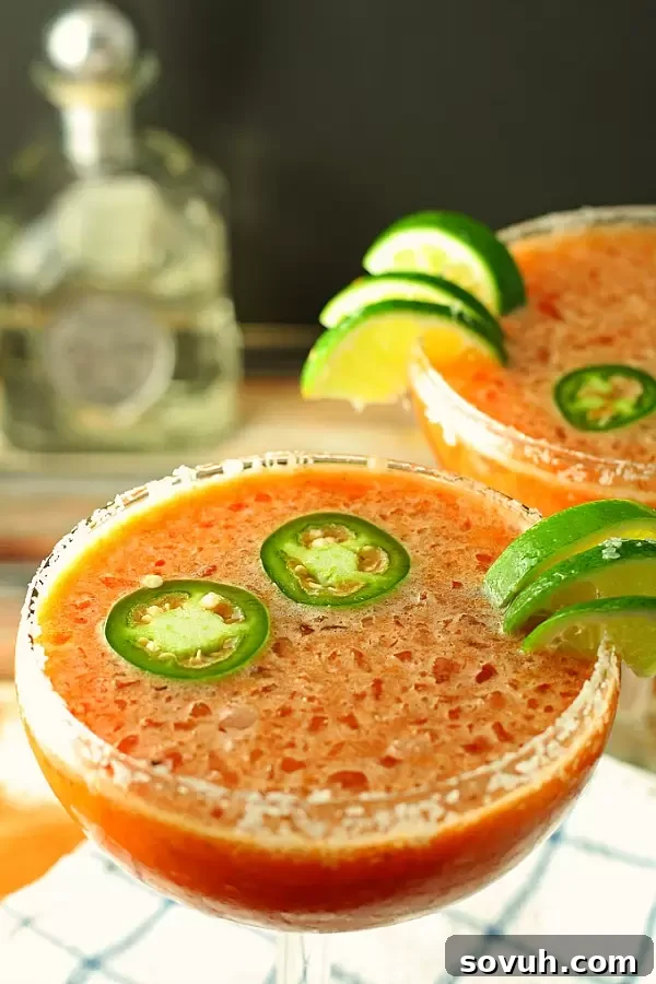 A refreshing Bloody Margarita, a unique blend of a Bloody Mary and a classic Margarita, garnished with lime.