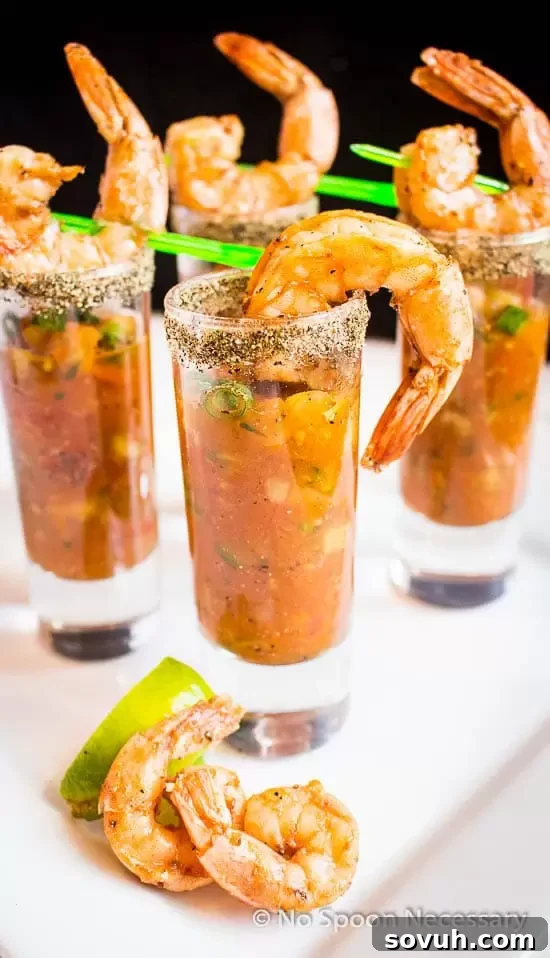 A vibrant red Bloody Mary cocktail, generously garnished, standing tall as a brunch centerpiece.