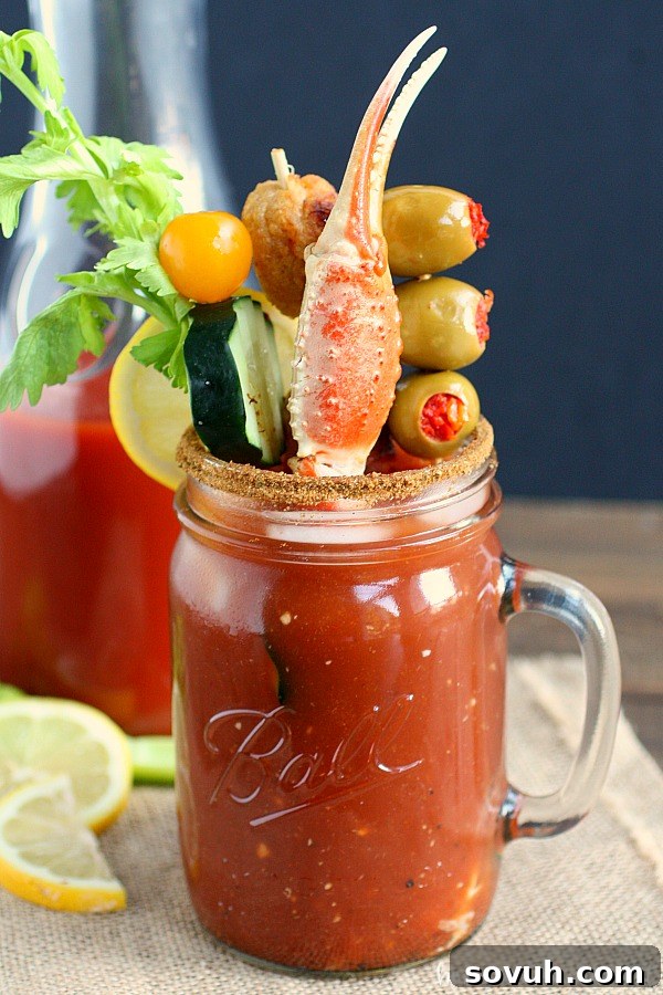 A Maryland Bloody Mary, richly garnished with celery, olives, and a distinctive Old Bay rim.