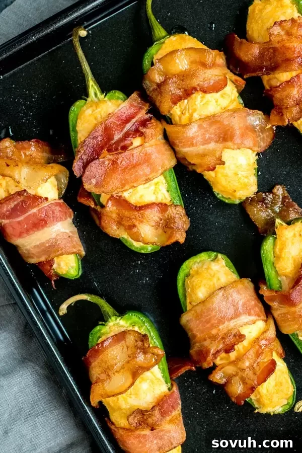 A vibrant tray of freshly baked Buffalo Chicken Jalapeno Poppers, ready to serve at a party