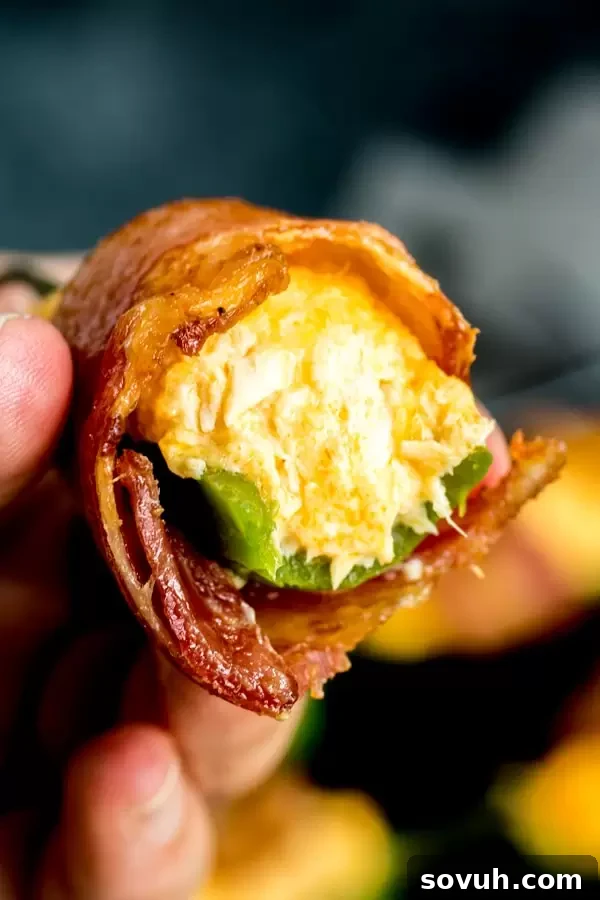 Close-up view of the interior of a Buffalo Chicken Jalapeno Popper, showing the creamy filling