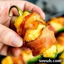 Crispy bacon-wrapped Buffalo Chicken Jalapeno Poppers ready to be served