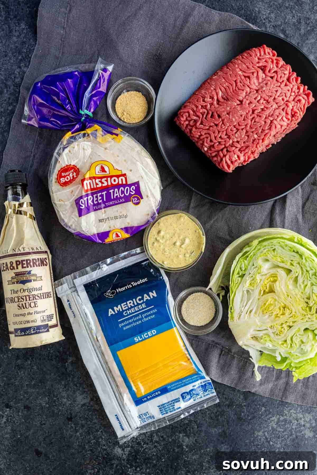 Big Mac-Style Smash Tacos with Homemade Big Mac Sauce 3 Ingredients for viral taco recipe displayed: ground beef, taco seasoning, Worcestershire sauce, street taco flour tortillas, American cheese slices, shredded lettuce, garlic powder, onion powder, and mustard—everything you need for easy weeknight dinner Big Mac smashed tacos.